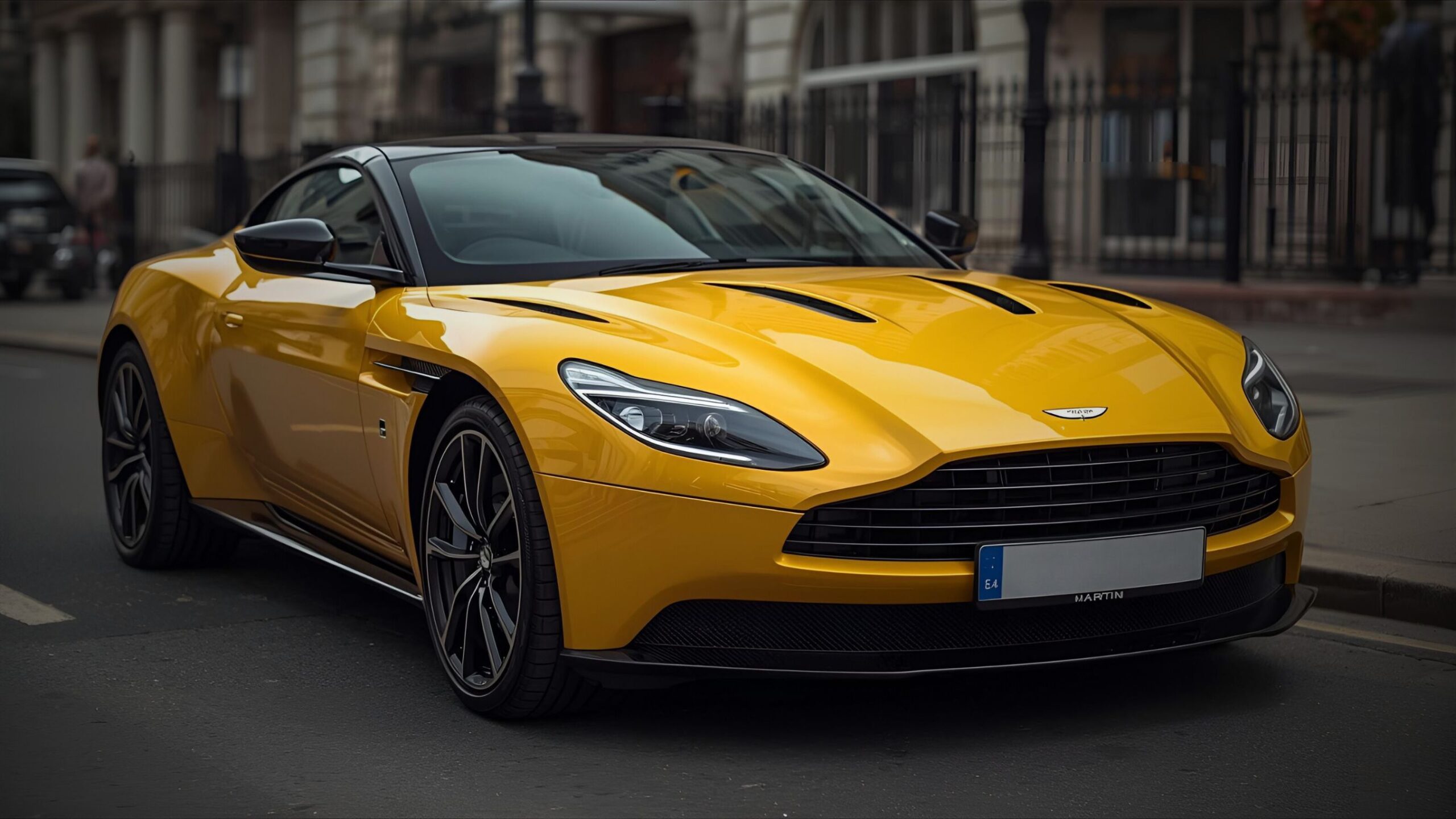 Close-up of a striking yellow Aston Martin DB11 or similar model high-performance sports car parked on a London street, representing luxury and high-value vehicle insurance.