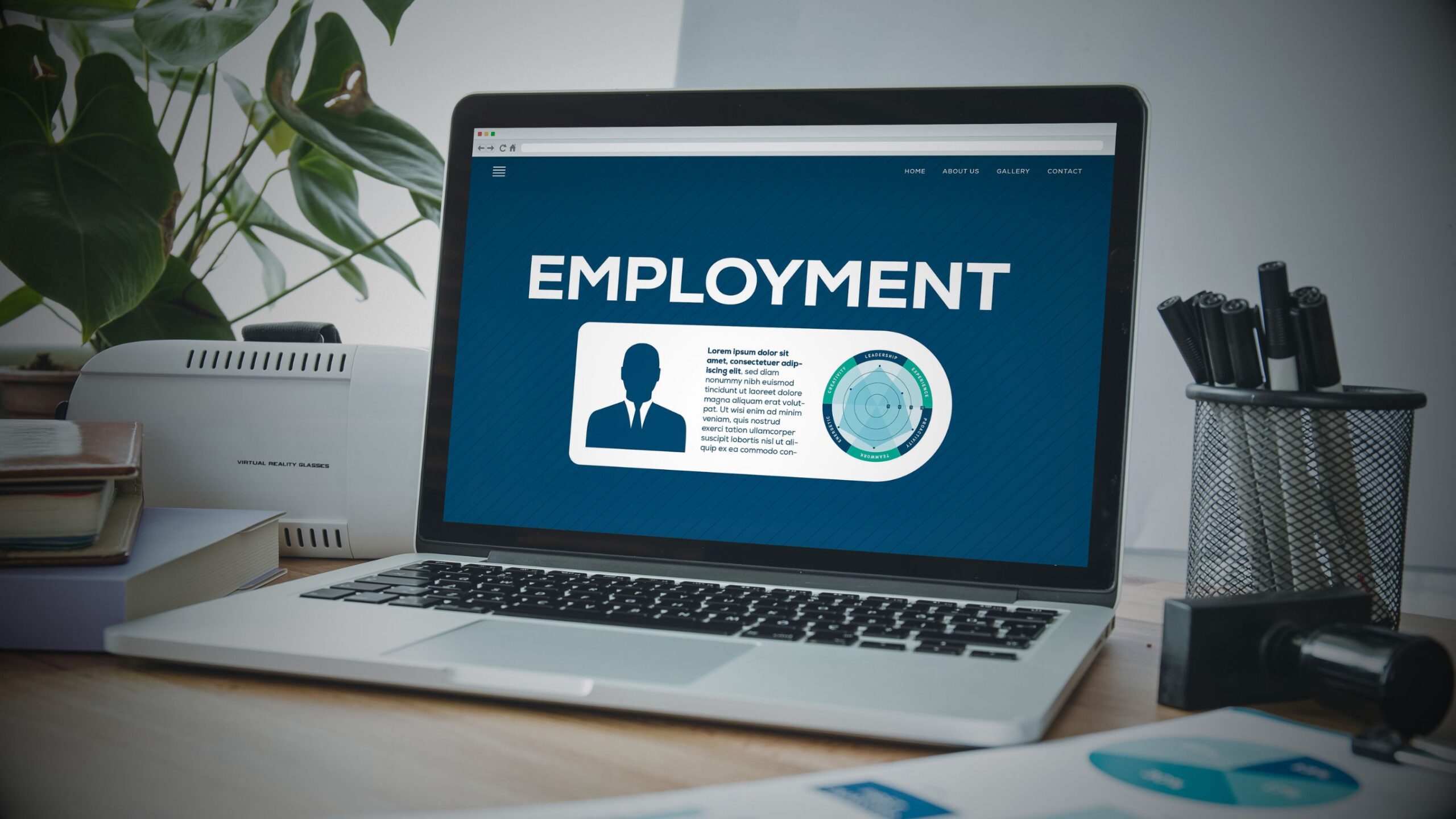 Employment law services UK for businesses. Laptop screen displaying "EMPLOYMENT" with a legal/HR dashboard. VINTTRO strategic law firm partners support.