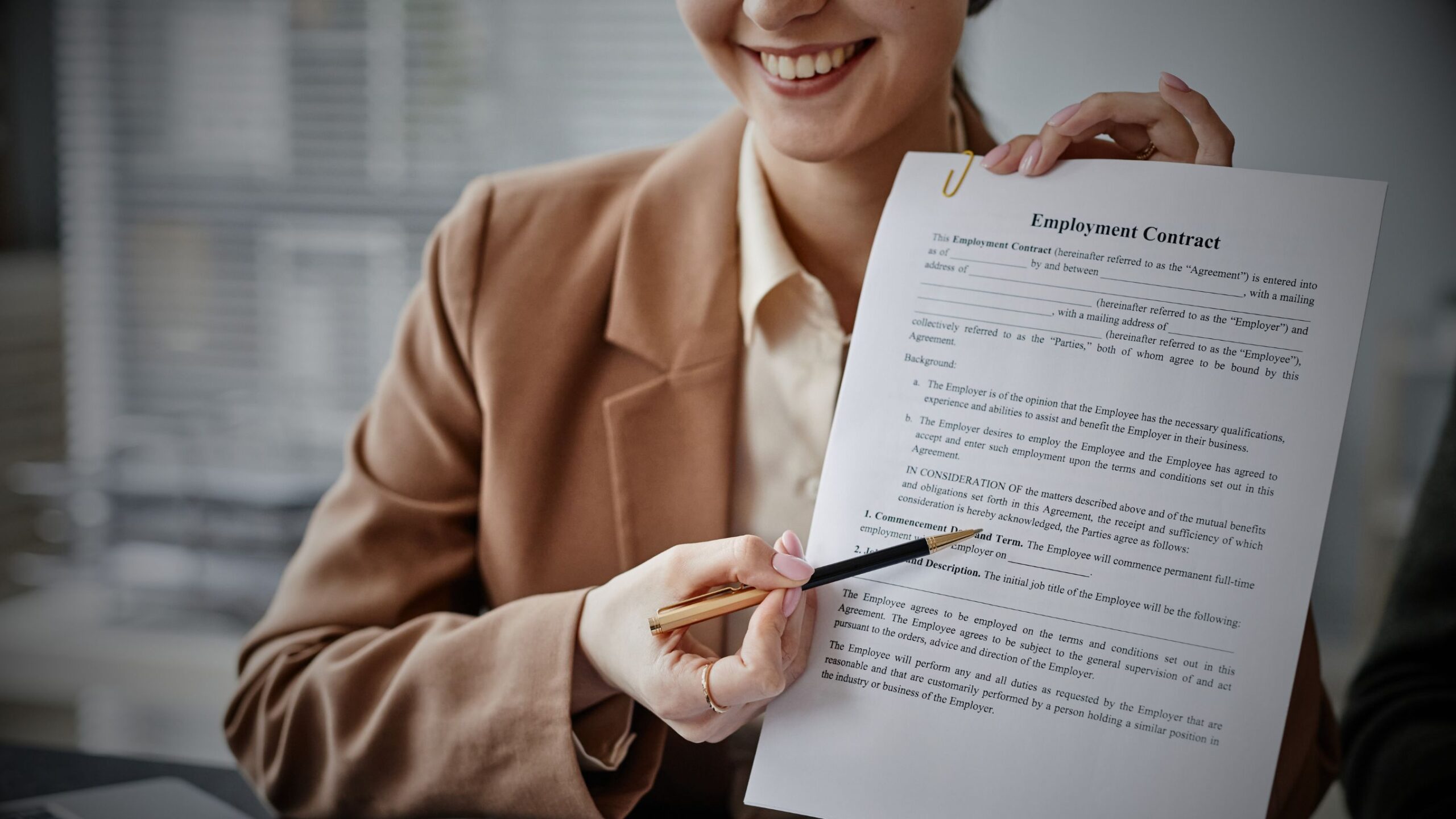 Immigration lawyer pointing to an Employment Contract for overseas worker