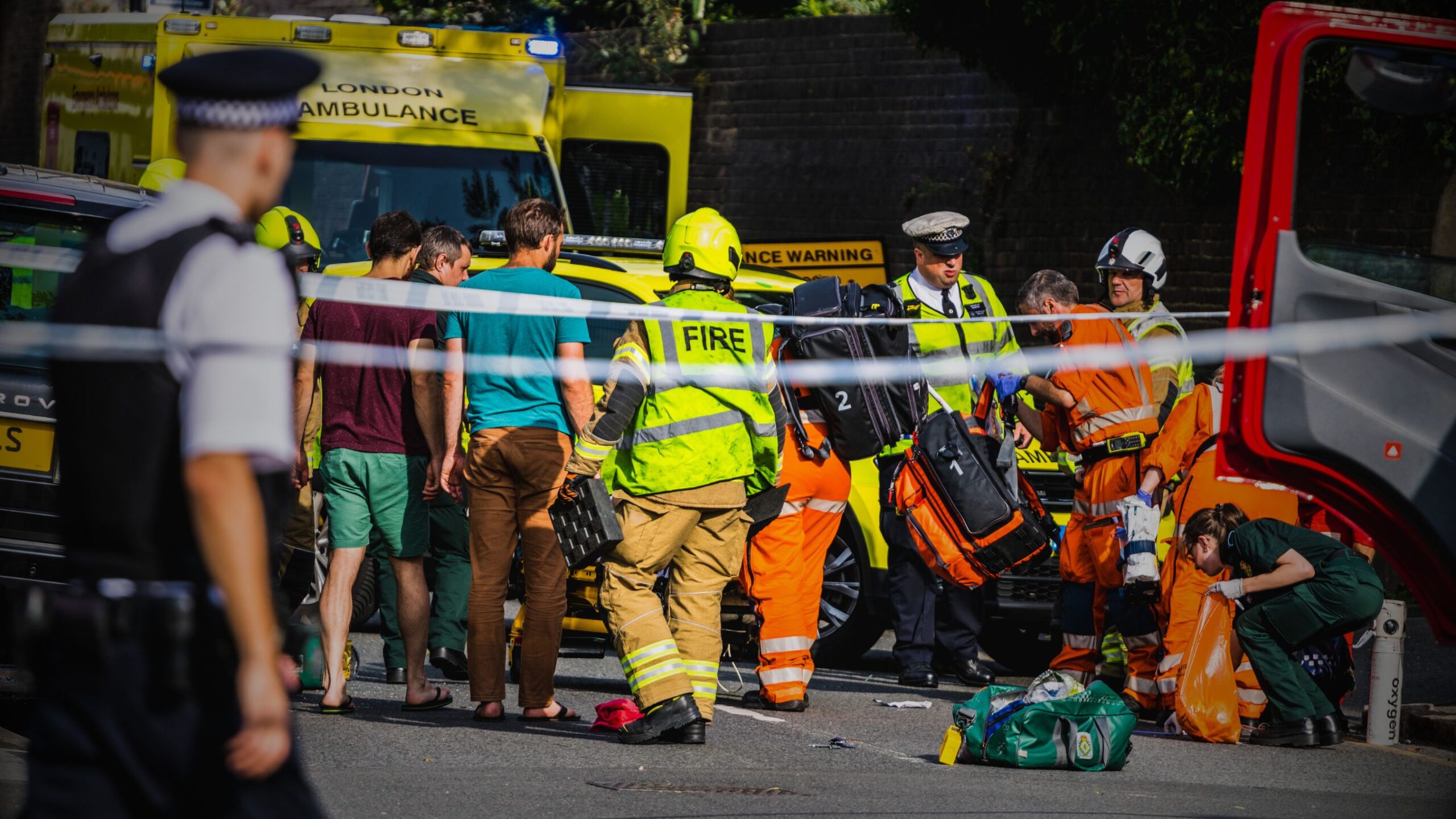 Accident Scene in the UK Emergency services (Police, Fire, and London Ambulance) at the scene of a serious road traffic incident, emphasising the critical need for VINTTRO's professional First Notification of Loss (FNOL) service.
