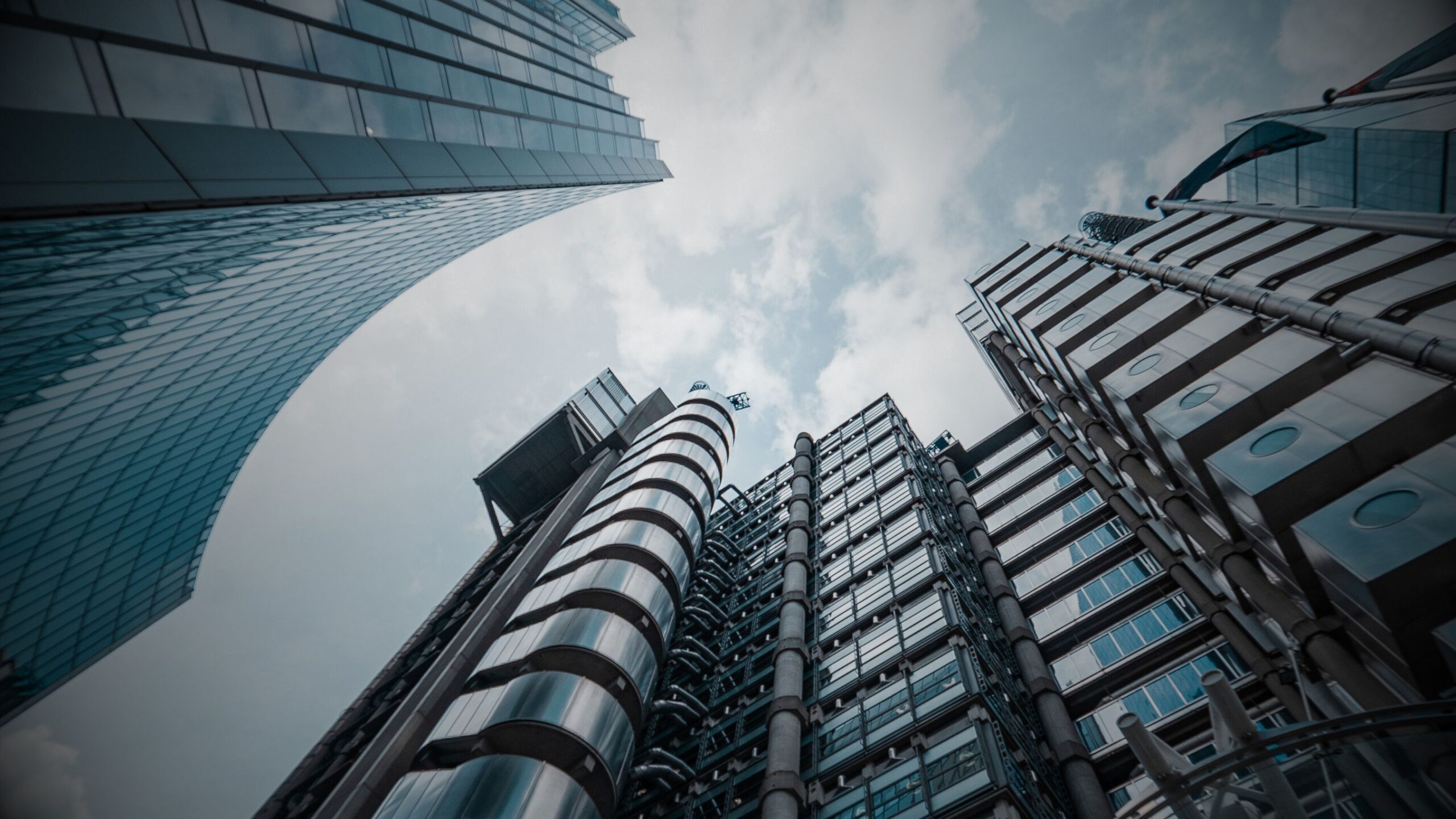 VINTTRO Corporate Legal Services. Worm's-eye view of Lloyds of London symbolising the dynamic, challenging world of corporate finance and complex commercial law where VINTTRO operates.