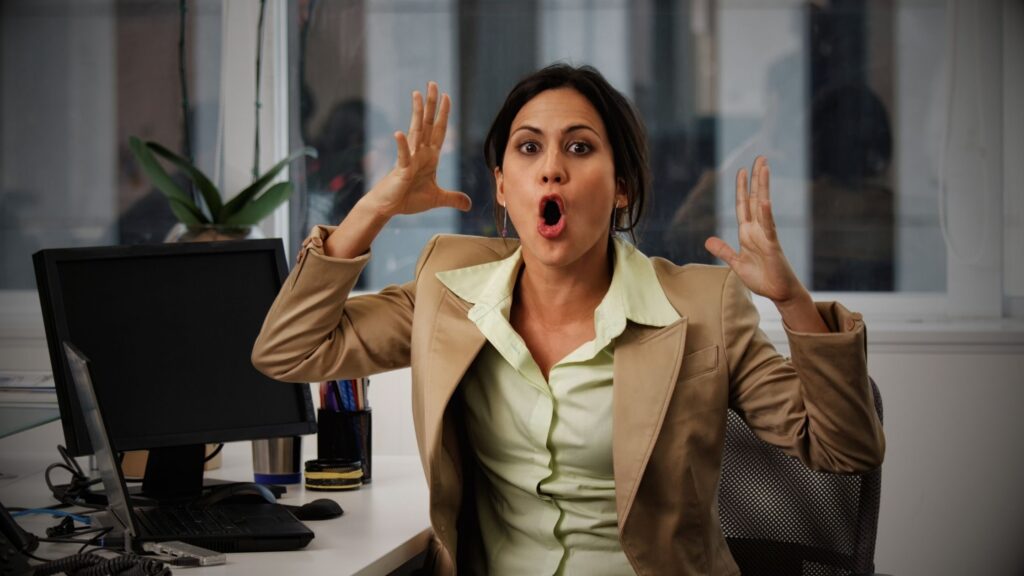A stressed vehicle owner looking over complex legal paperwork and a credit agreement, appearing confused and worried about the hidden costs of a credit hire car