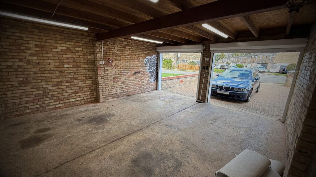 This image shows untidy home garage storage before complete overall to a home showroom.